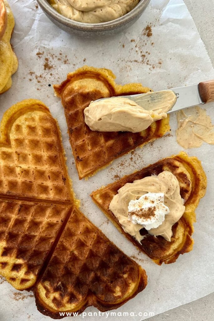 Sourdough pumpkin waffles topped with spiced pumpkin cream cheese.