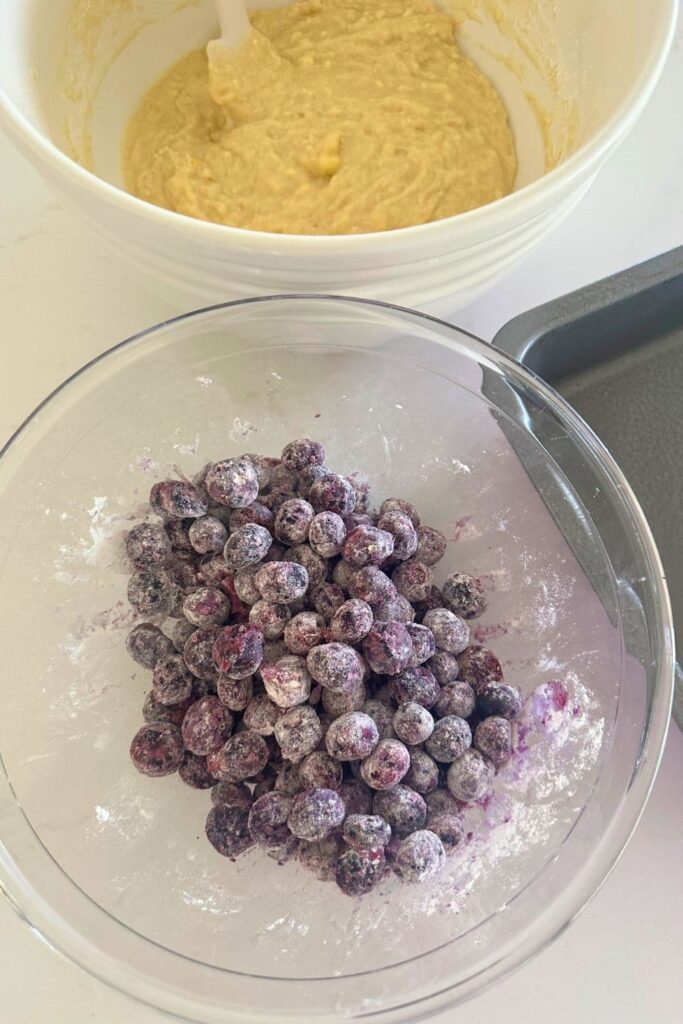 Bowl of frozen blueberries dusted in flour.