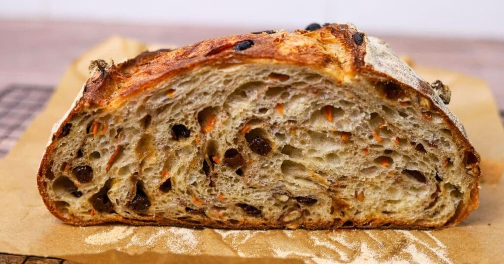 Crumb shot of sourdough carrot cake bread.