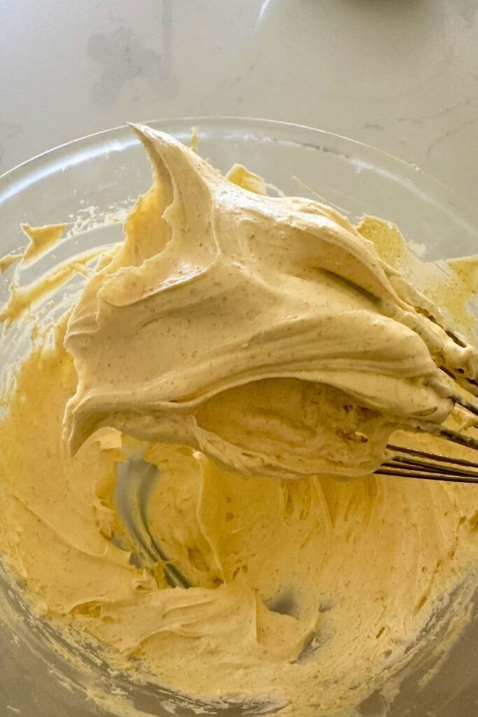 The finished product - whipped brown butter light and airy and sticking to the whisk.