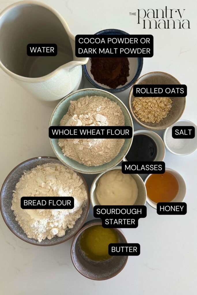 Flay lay of ingredients necessary to make sourdough brown bread.