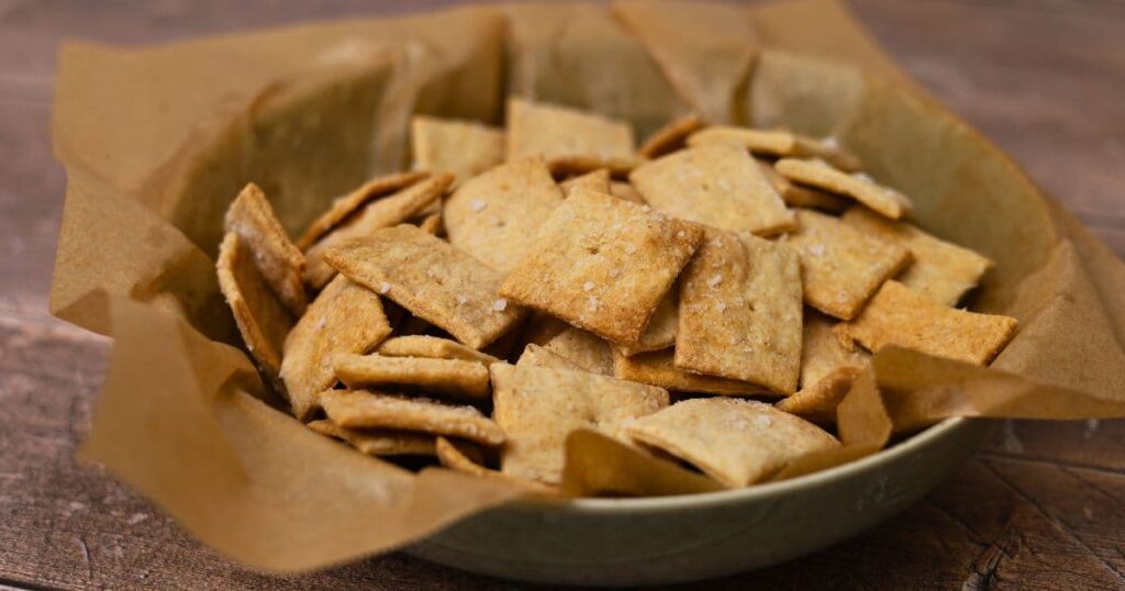 A bowl of sourdough whole wheat crackers.