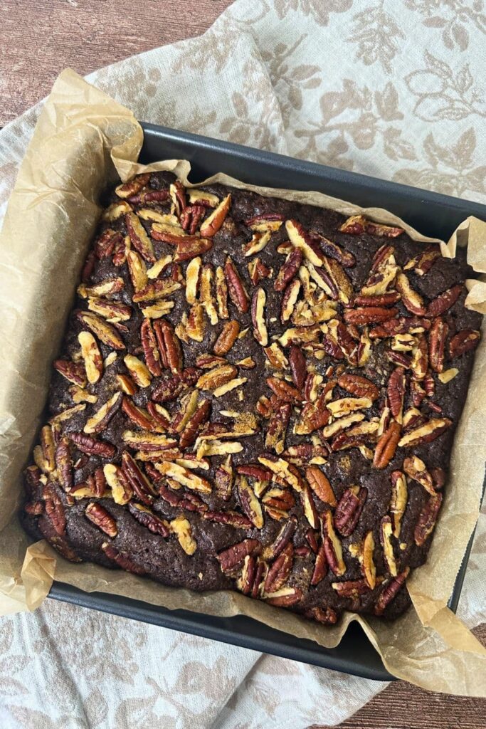 Spiced sourdough brownies that have just been baked and taken out of the oven to cool in the pan.