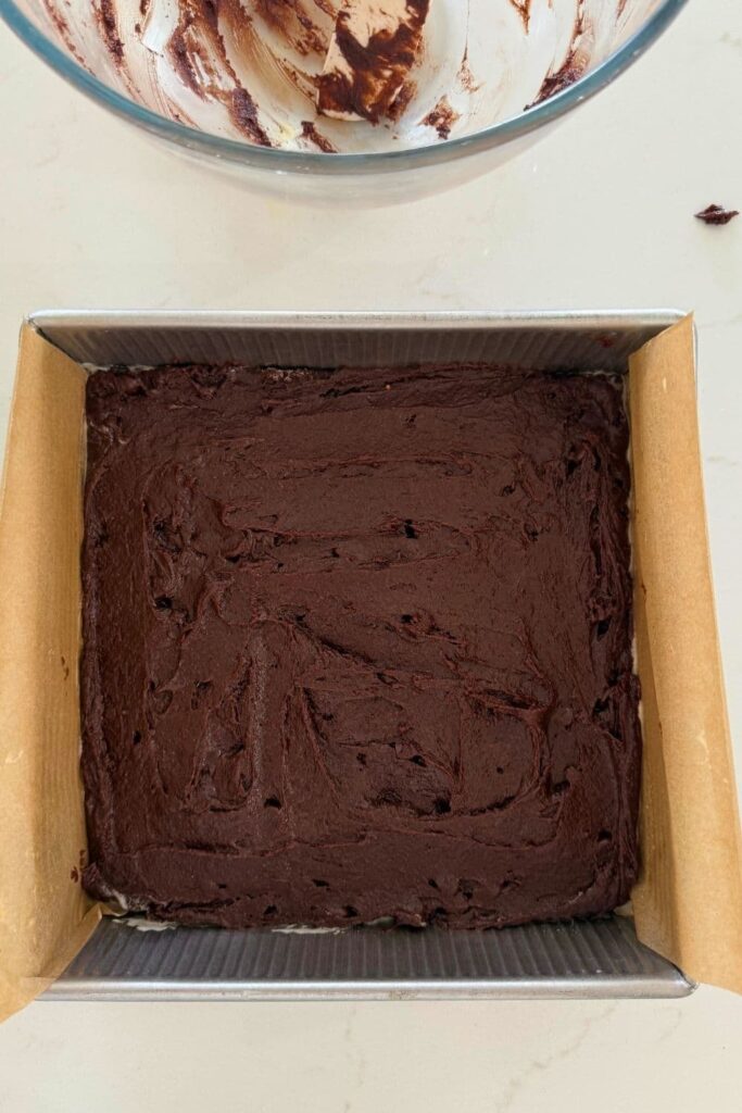 Sourdough cosmic brownies batter in baking pan.