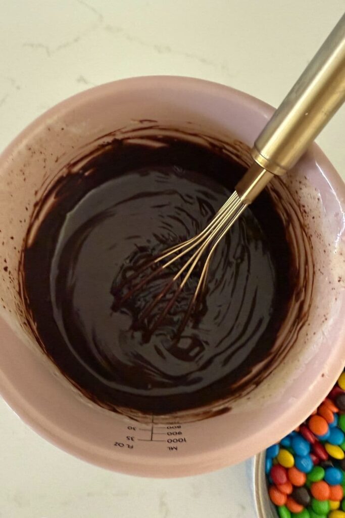 Sourdough cosmic brownies ganache topping being mixed together.