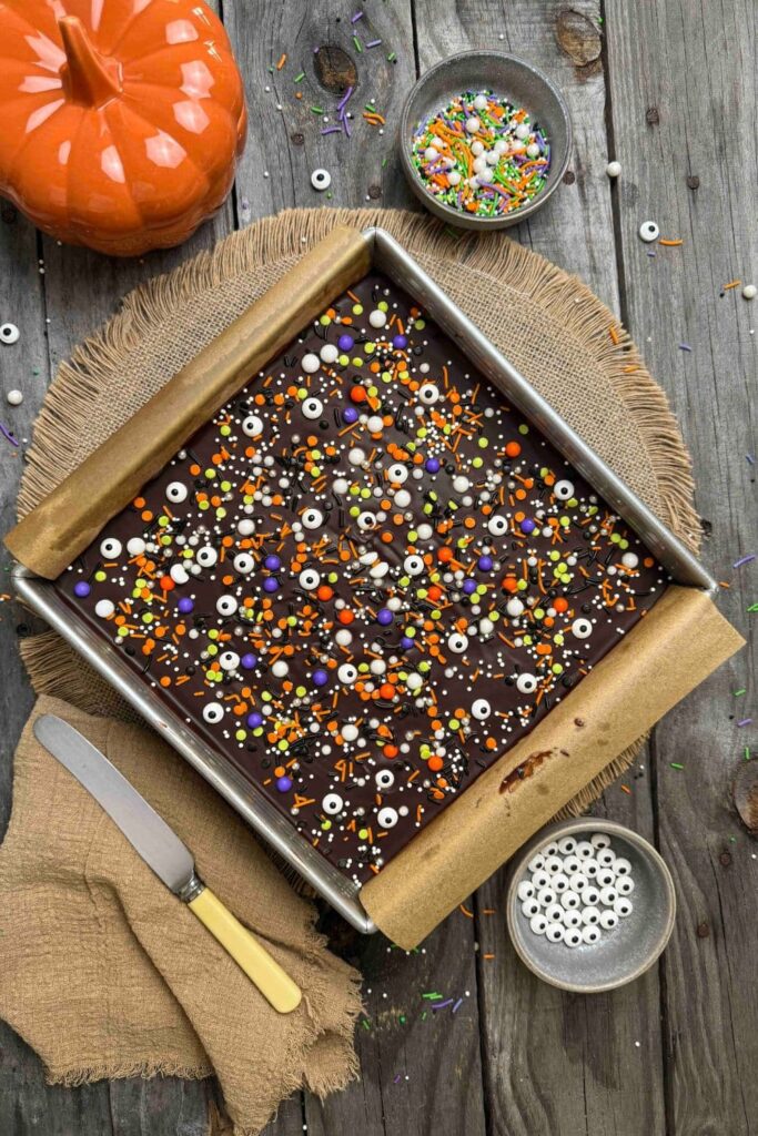 Sourdough Halloween frosted brownies baked and frosted in baking pan on table.