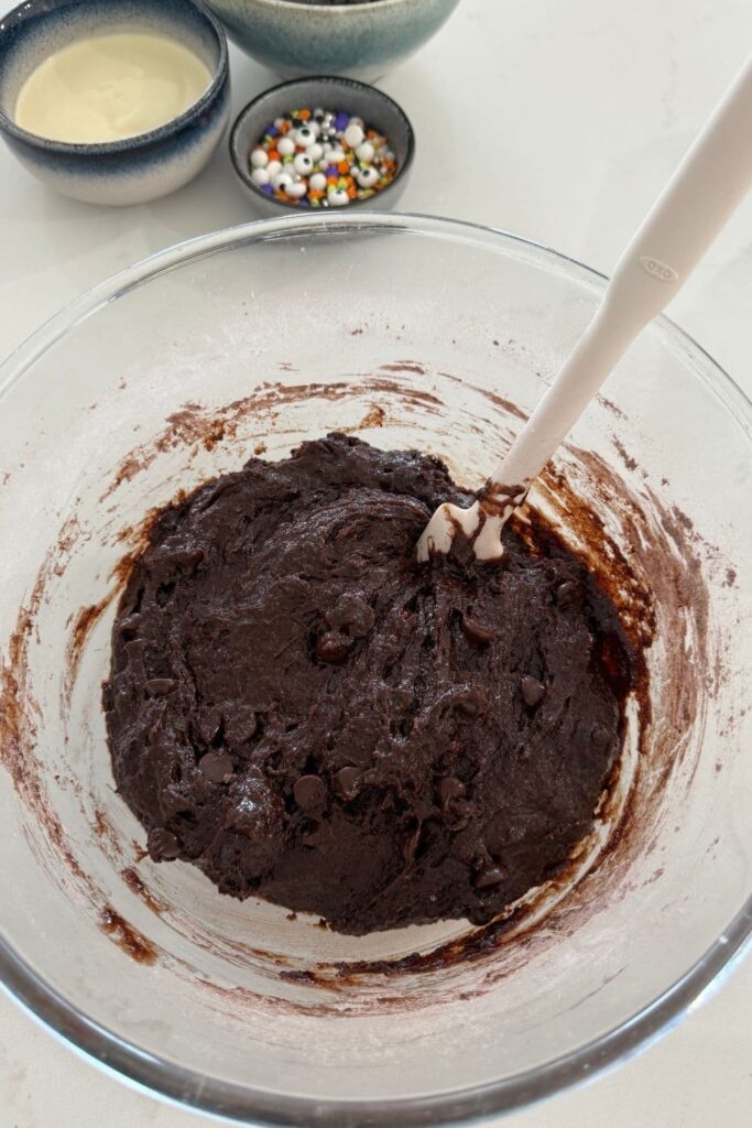Sourdough Halloween frosted brownie batter mixed together in bowl.