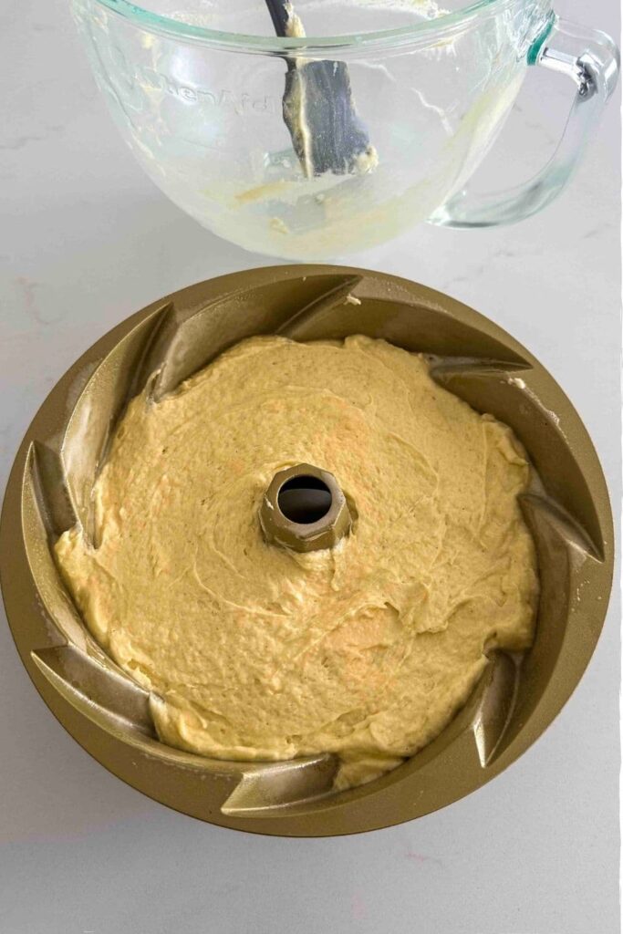 sourdough pound cake batter in a Bundt pan.