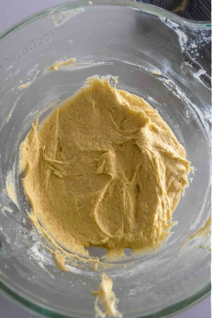 butter and sugar creamed together in glass mixing bowl for sourdough pound cake.
