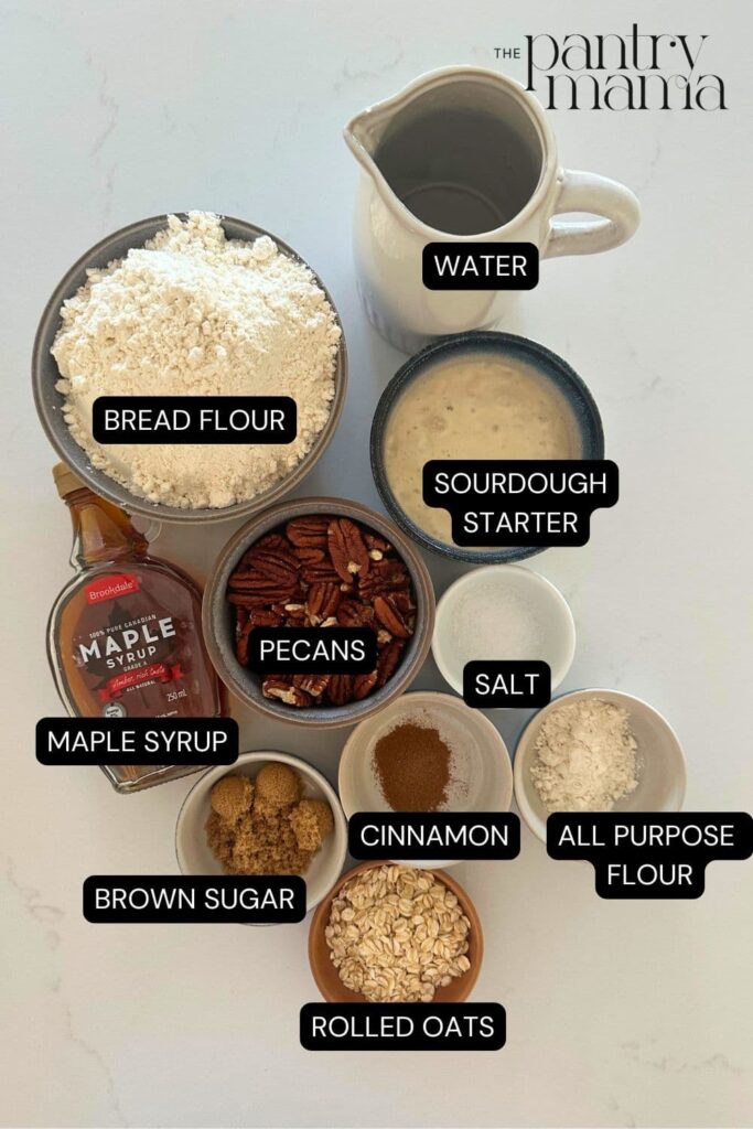 Sourdough maple pecan loaf labeled ingredients on counter. 