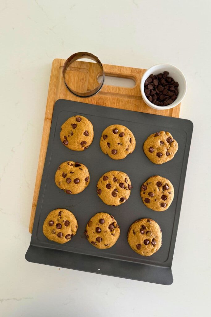 Sourdough pumpkin chocolate chip cookies on baking sheet just out of the oven.