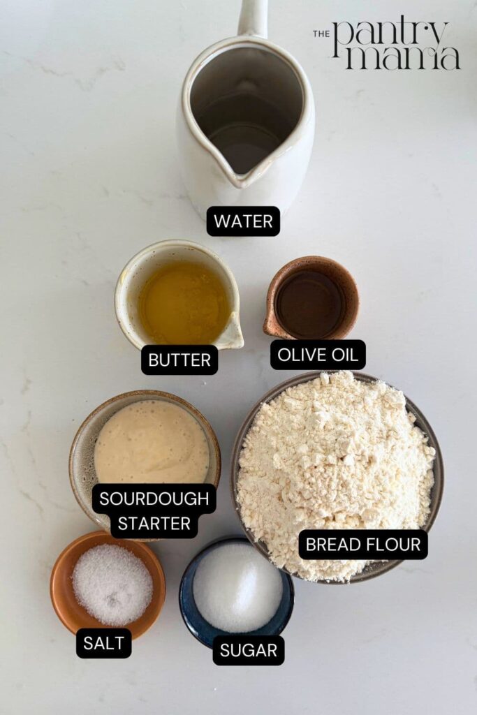 Labeled ingredients on counter for sourdough burger buns.
