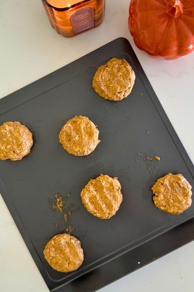Sourdough pumpkin oatmeal cookie dough on baking sheet, ready for the oven.