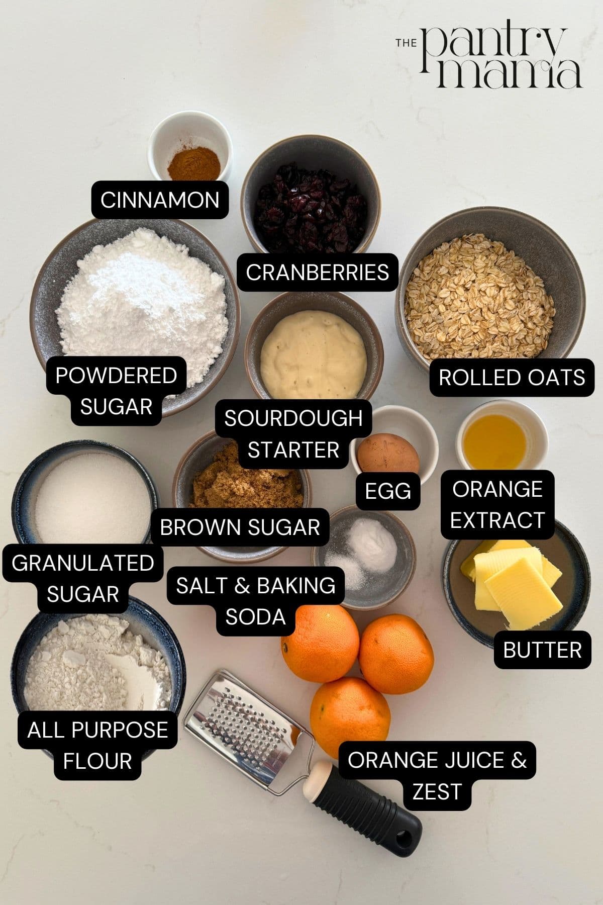 Labeled ingredients on counter to make orange cranberry sourdough oatmeal cookies.