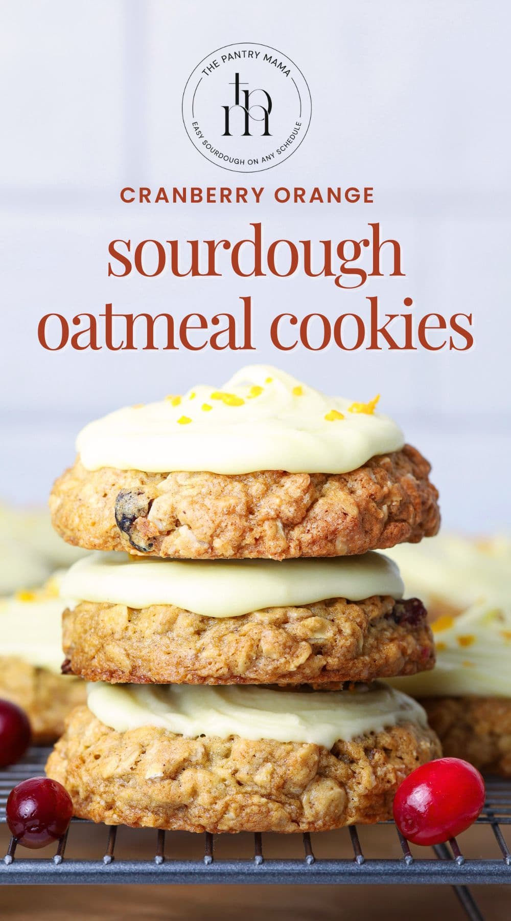 Three orange cranberry sourdough oatmeal cookies stacked with text overlay for Pinterest Pin image.