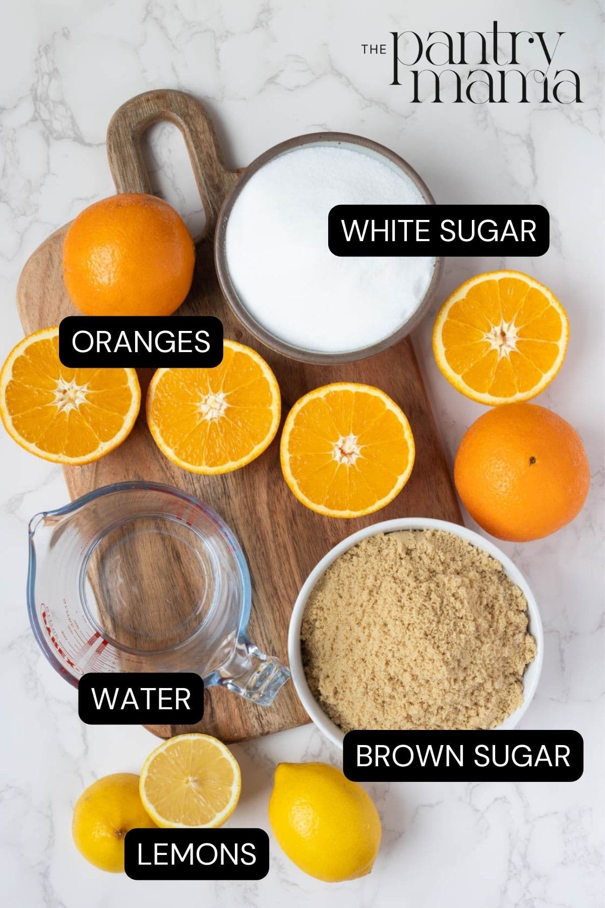 Labeled ingredients on counter to make a shortcut orange marmalade recipe.