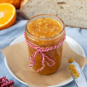 Close up of a jar of fresh made shortcut orange marmalade.